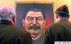Why Annaud didn't make Danilov and Zaitsev to fall to their knees in front of thit portrait?